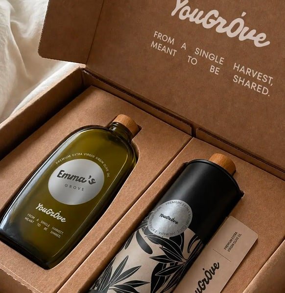 The first bottle in its open gift box